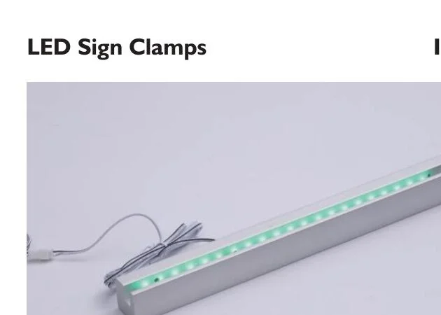 XC15-80 LED sign clamp bar — green LED strip with silver aluminum housing and wire connection on white background